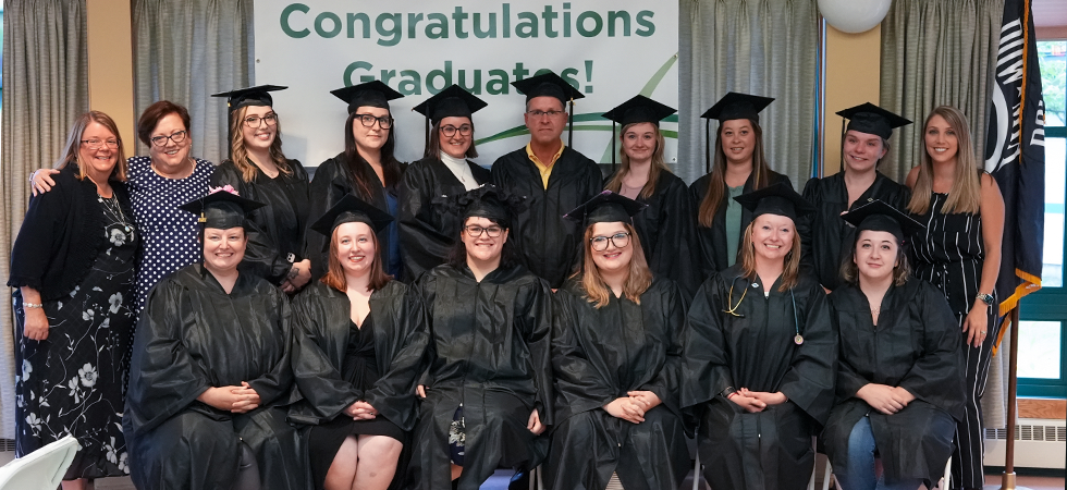The first class of LPN Pathway Program graduates pose for a group picture at a July 8 ceremony at Woodridge Rehabilitation & Nursing.